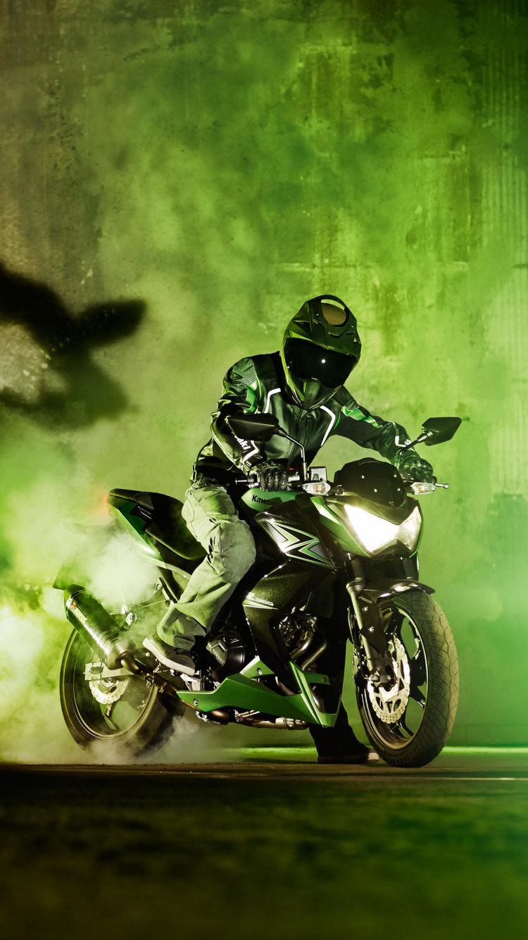 Man Riding Motorcycle on Road During Daytime. Wallpaper in 750x1334 Resolution