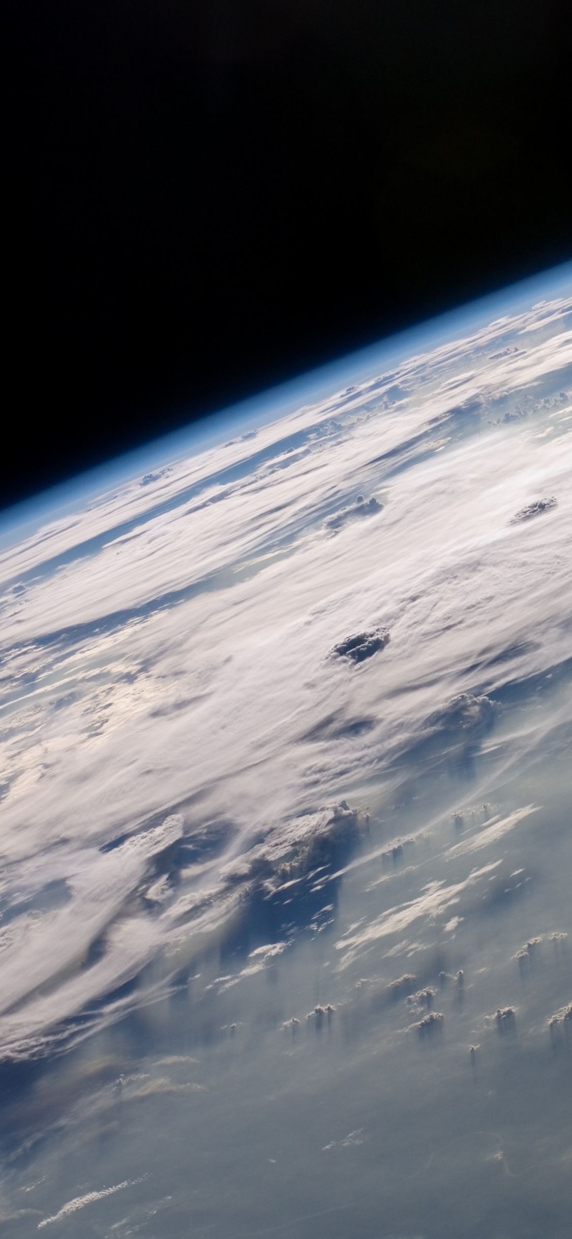 White Clouds and Blue Sky. Wallpaper in 1125x2436 Resolution