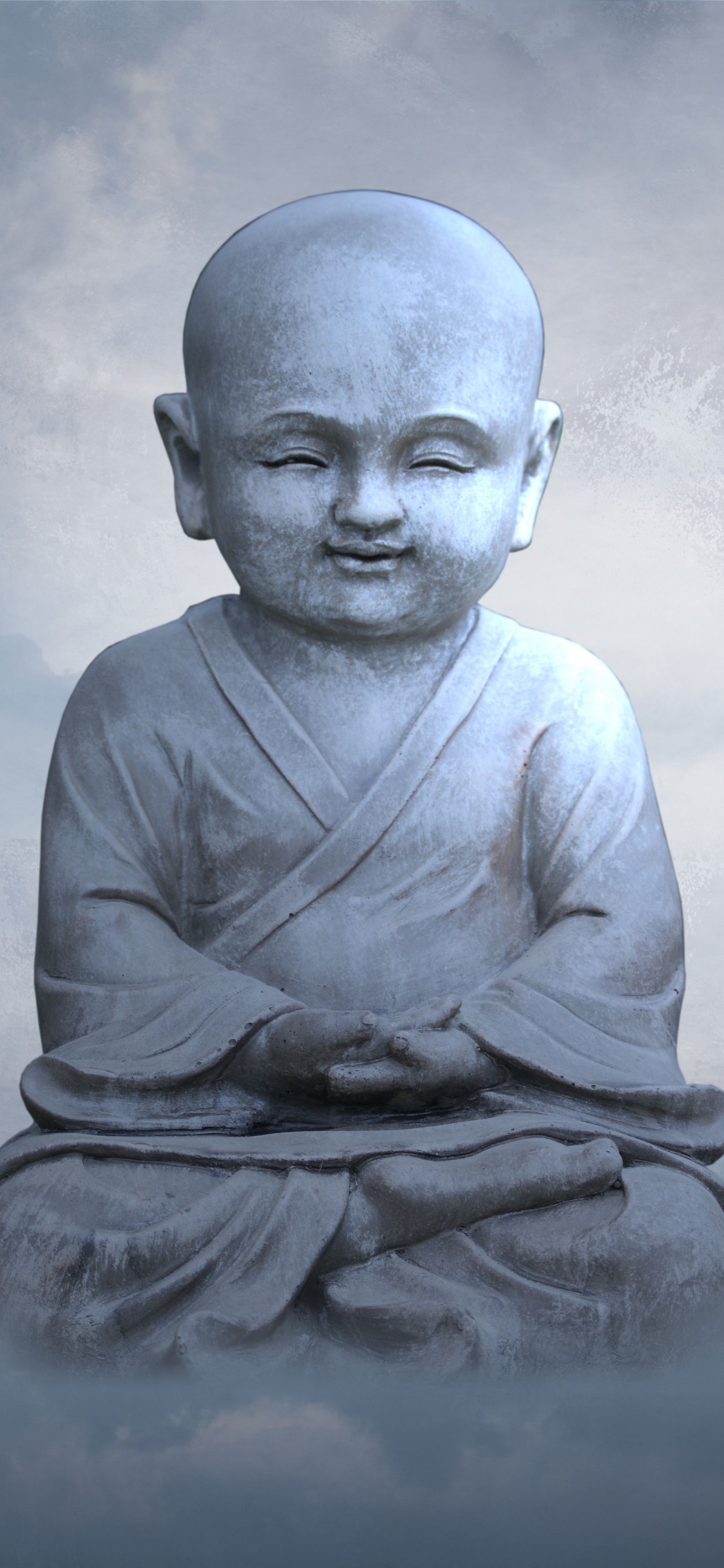 Man in Gray Long Sleeve Shirt Sitting on Rock. Wallpaper in 1125x2436 Resolution