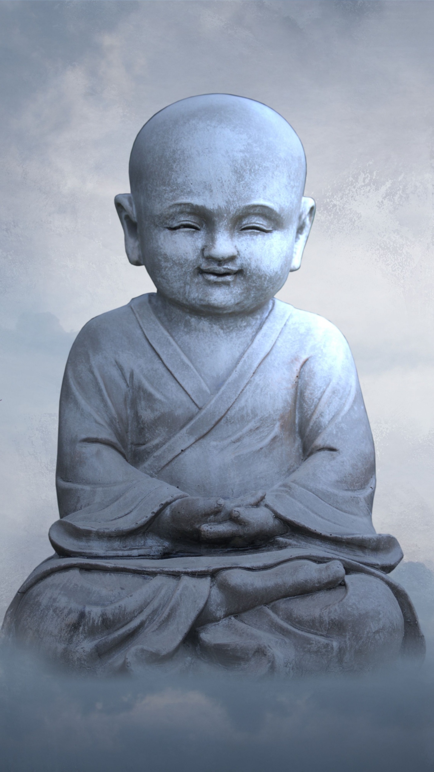 Man in Gray Long Sleeve Shirt Sitting on Rock. Wallpaper in 1440x2560 Resolution