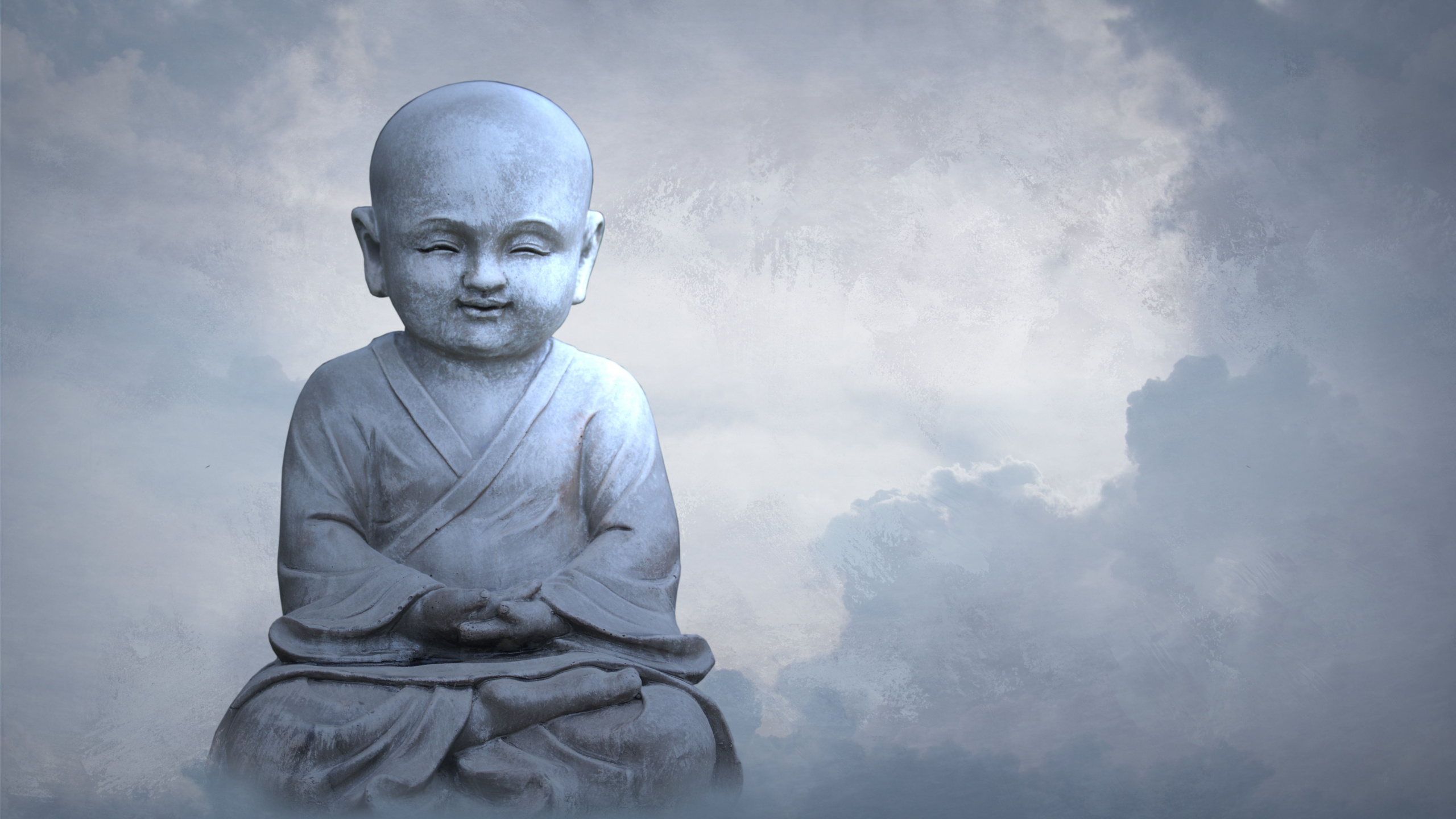 Man in Gray Long Sleeve Shirt Sitting on Rock. Wallpaper in 2560x1440 Resolution