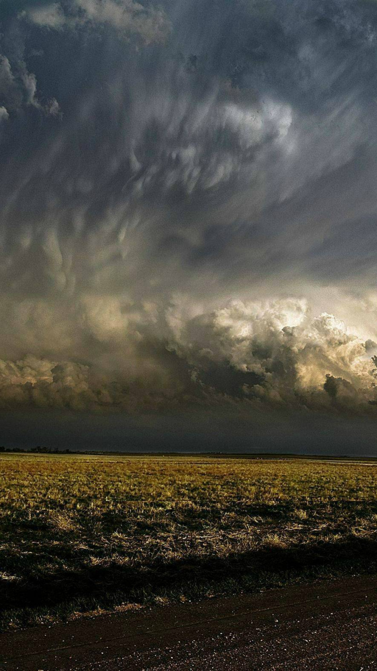 White Clouds Over The Field. Wallpaper in 750x1334 Resolution
