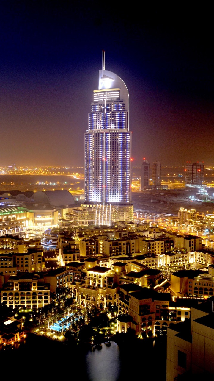 Weißes Und Schwarzes Betongebäude Während Der Nacht. Wallpaper in 720x1280 Resolution