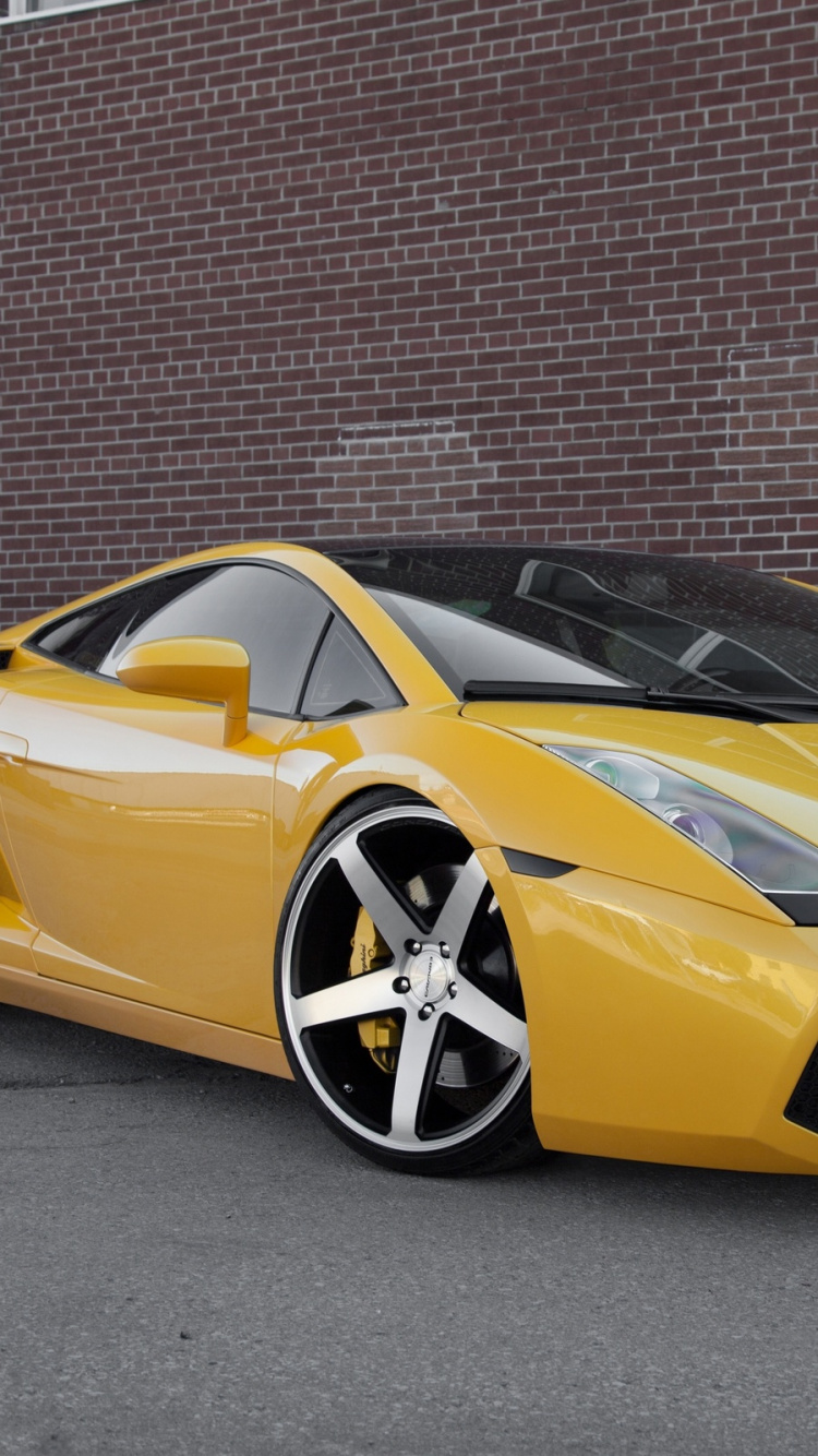 Lamborghini Aventador Jaune Garée à Côté du Mur de Briques Brunes. Wallpaper in 750x1334 Resolution