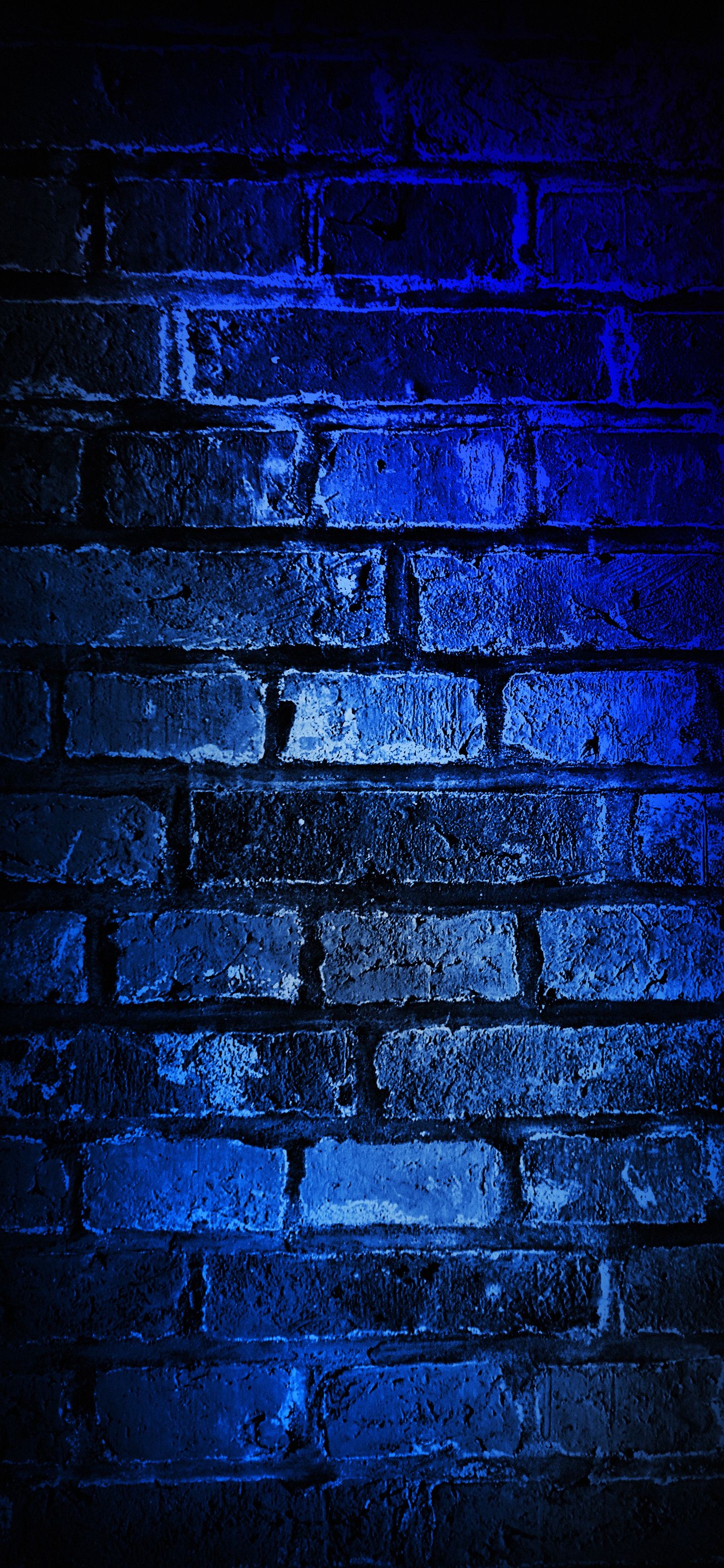 Premium Photo  Brick wall with dark blue color and spotlight on surface as  background long picture