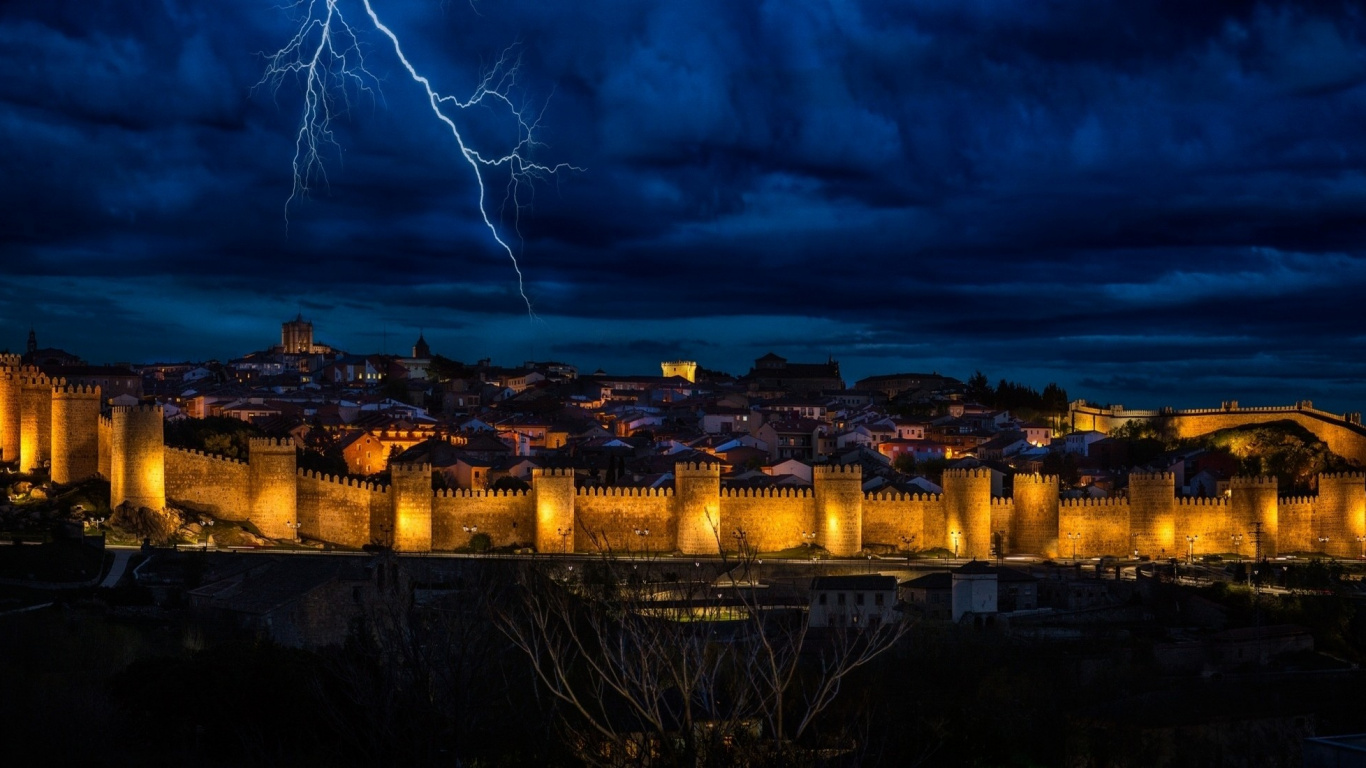 City Skyline Under Blue Sky and White Clouds During Night Time. Wallpaper in 1366x768 Resolution