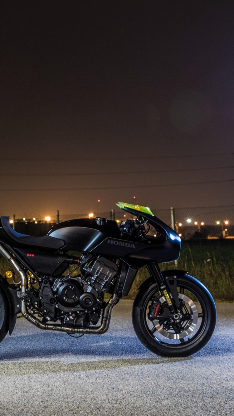 Black and Green Sports Bike on Gray Asphalt Road During Night Time. Wallpaper in 750x1334 Resolution