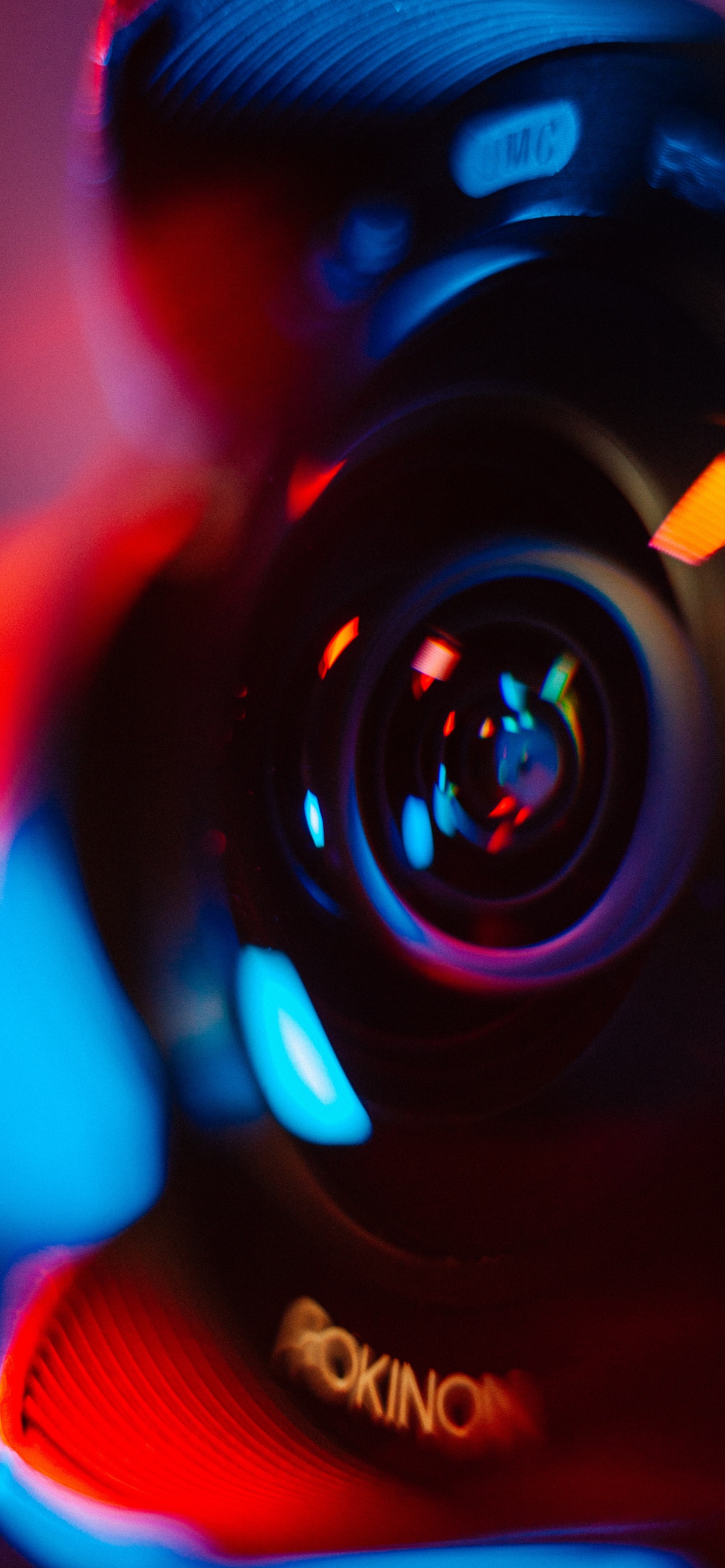 Black and Orange Camera Lens. Wallpaper in 1242x2688 Resolution