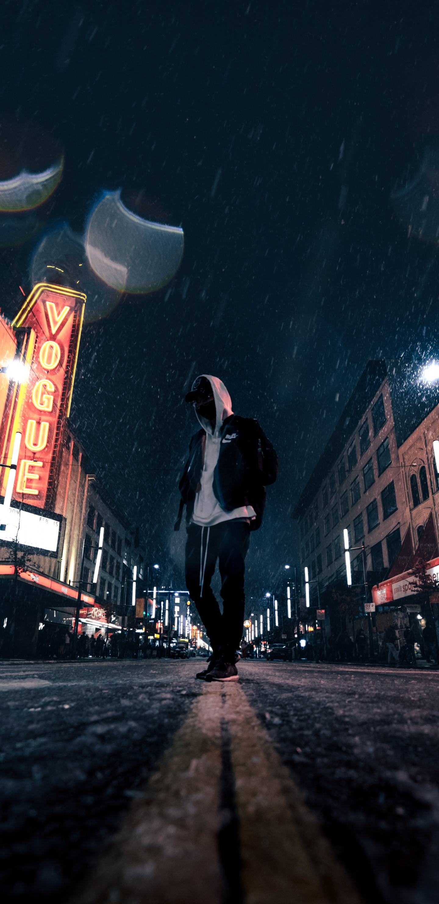 Man in White Shirt and Black Pants Walking on Street During Night Time. Wallpaper in 1440x2960 Resolution