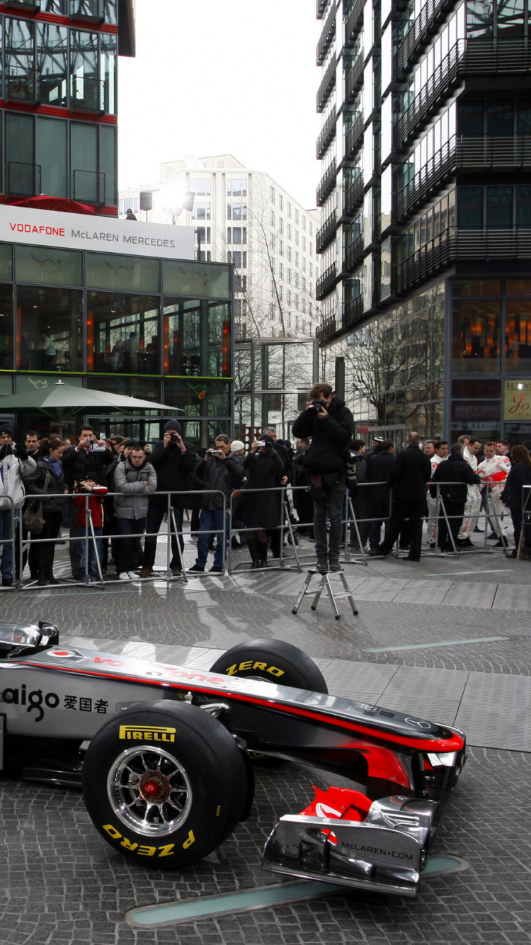 Black and Red Ferrari f 1 on Road During Daytime. Wallpaper in 750x1334 Resolution