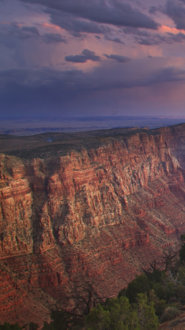 Brown Rock Formation Under Cloudy Sky During Daytime. Wallpaper in 750x1334 Resolution