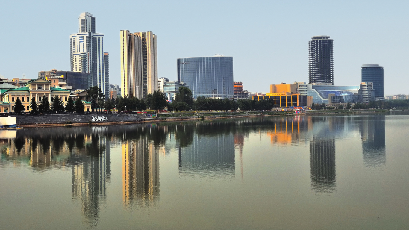 City Skyline Across Body of Water During Daytime. Wallpaper in 1366x768 Resolution