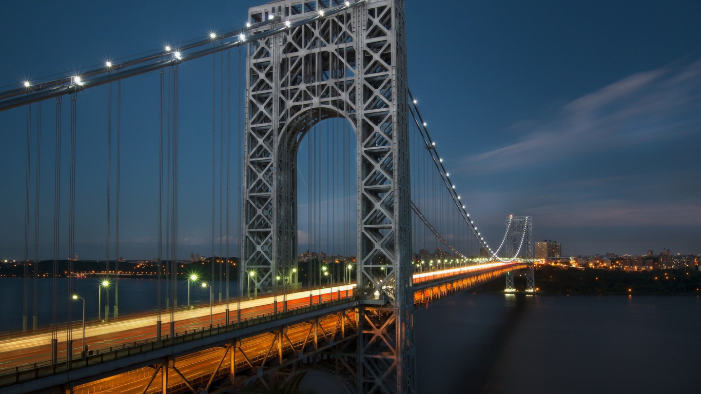 Gray Bridge Over Body of Water During Night Time. Wallpaper in 1366x768 Resolution