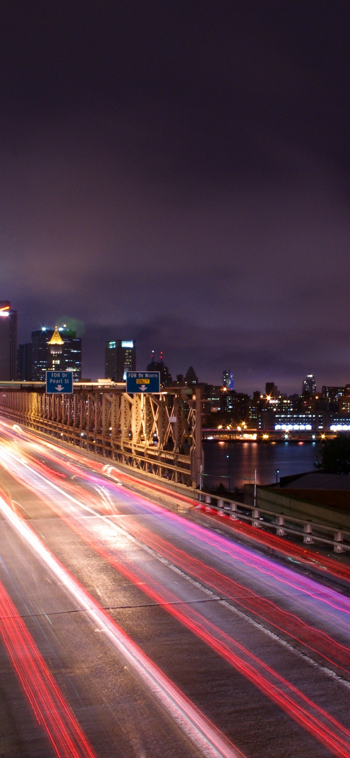 Time Lapse Photography of City During Night Time. Wallpaper in 1125x2436 Resolution