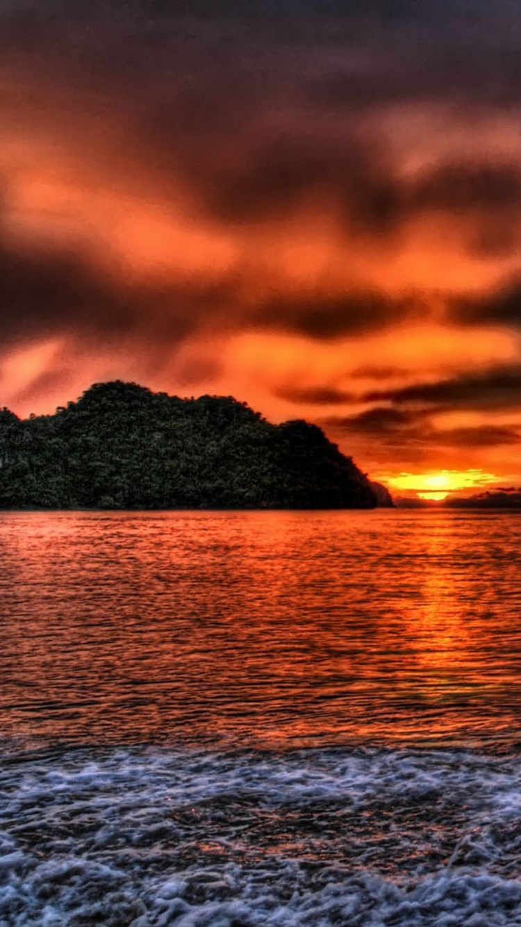 Body of Water Under Cloudy Sky During Sunset. Wallpaper in 750x1334 Resolution