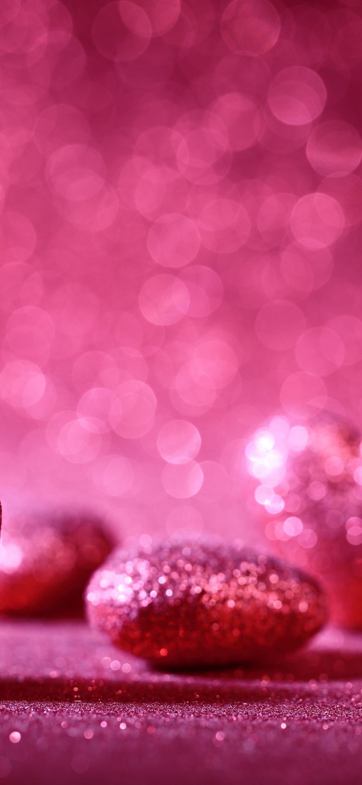 Black and Red Heart Shaped Stones on Red Surface. Wallpaper in 1242x2688 Resolution