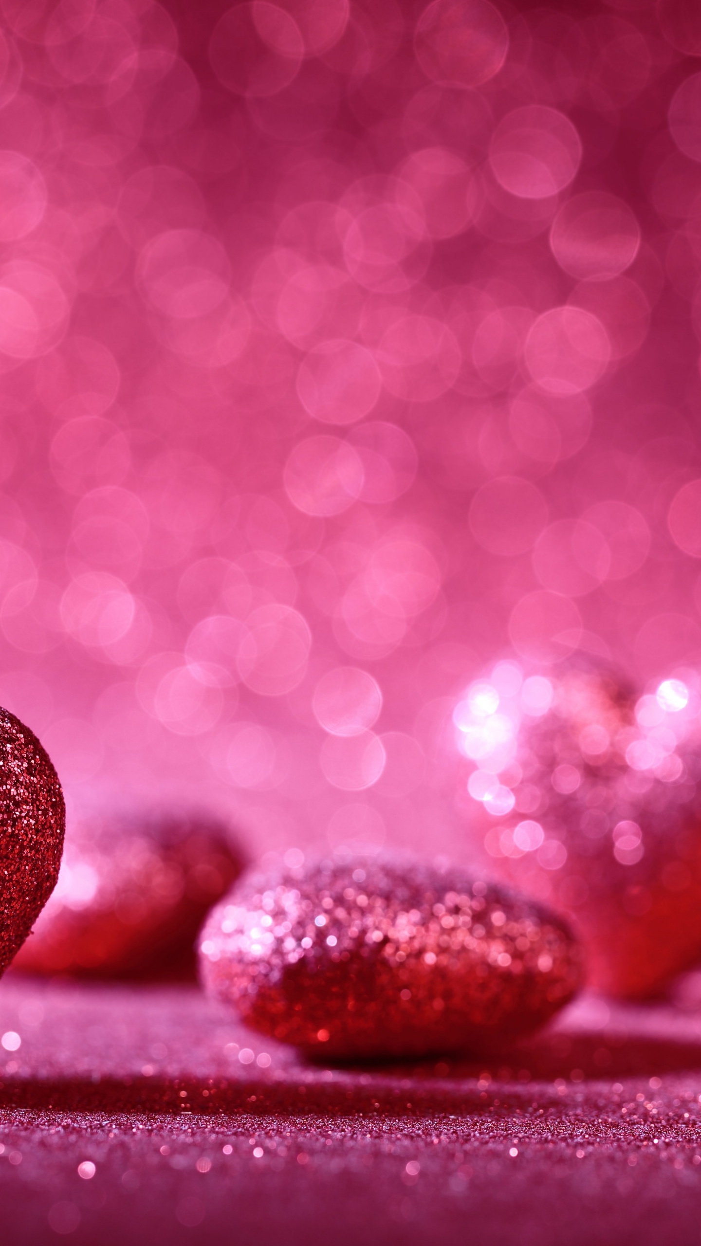 Black and Red Heart Shaped Stones on Red Surface. Wallpaper in 1440x2560 Resolution