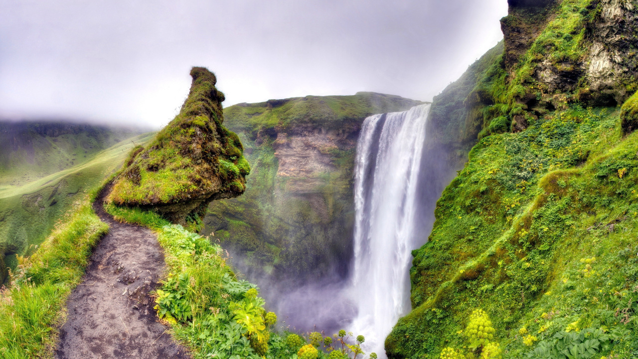 Waterfalls on Green Moss Covered Mountain Under Gray Cloudy Sky. Wallpaper in 1280x720 Resolution