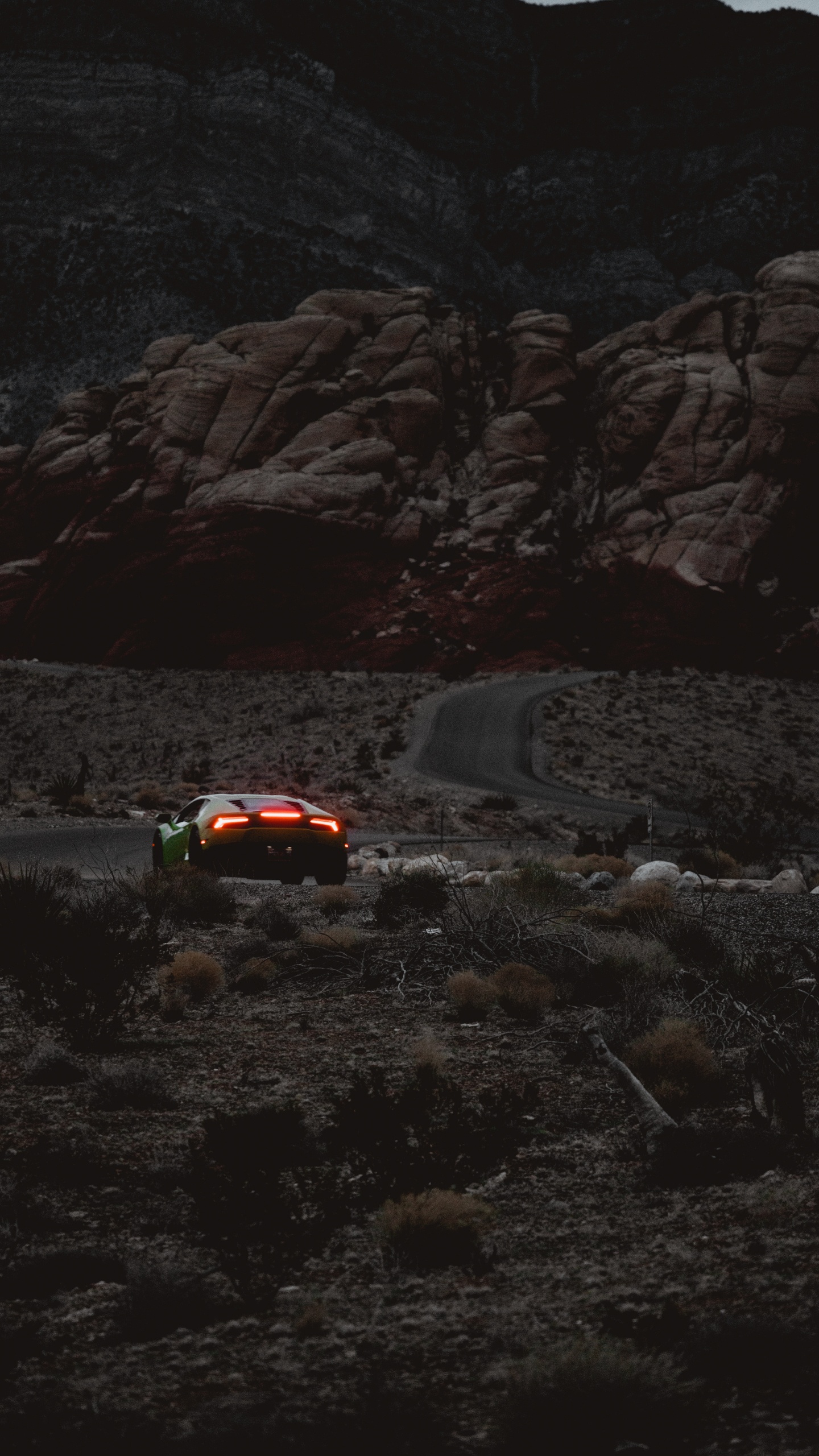 Red Car on Road Near Rocky Mountain During Daytime. Wallpaper in 1440x2560 Resolution