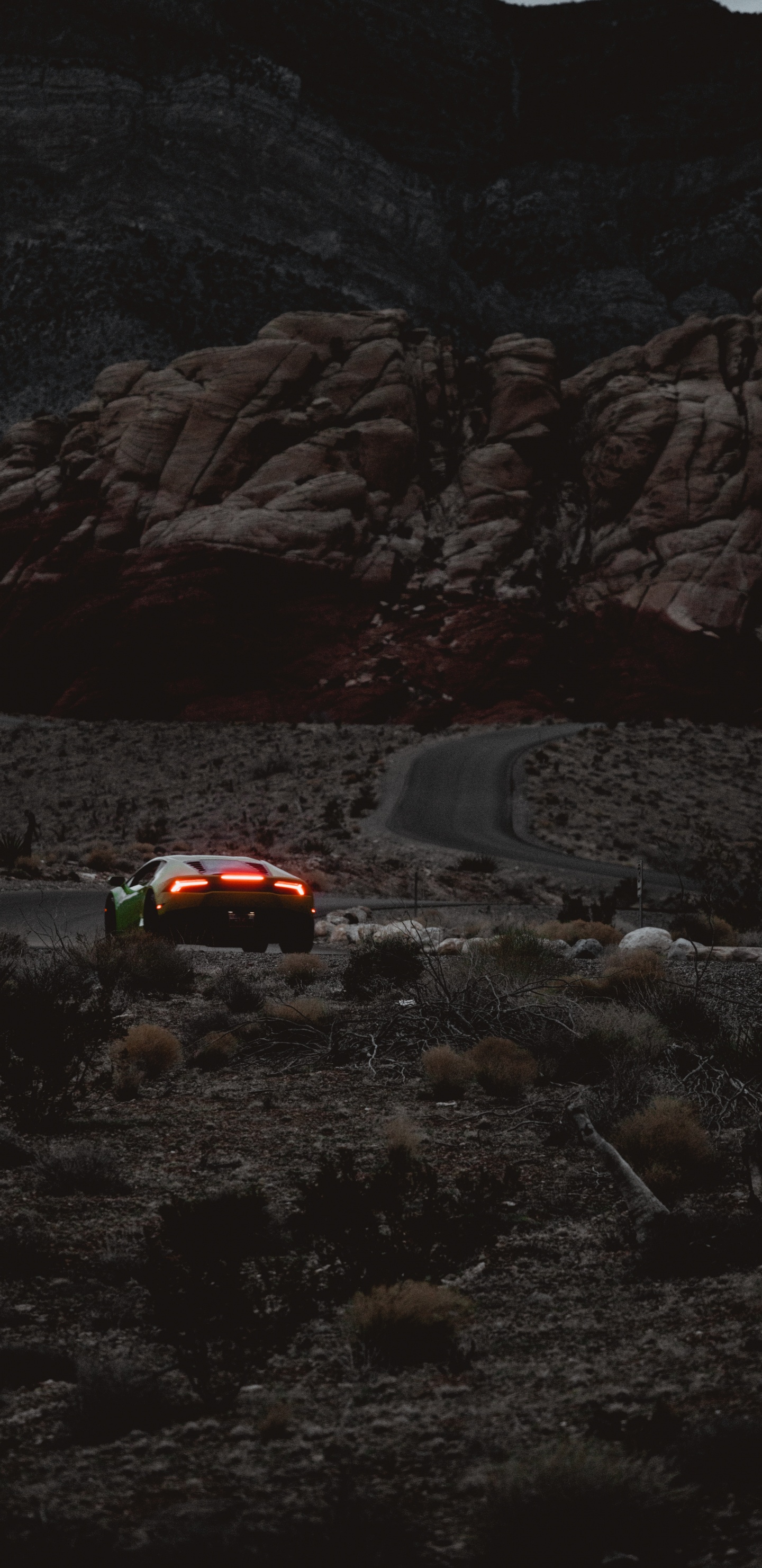 Red Car on Road Near Rocky Mountain During Daytime. Wallpaper in 1440x2960 Resolution