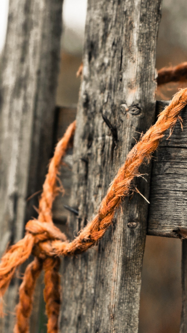 Brown Rope on Brown Wooden Fence. Wallpaper in 750x1334 Resolution