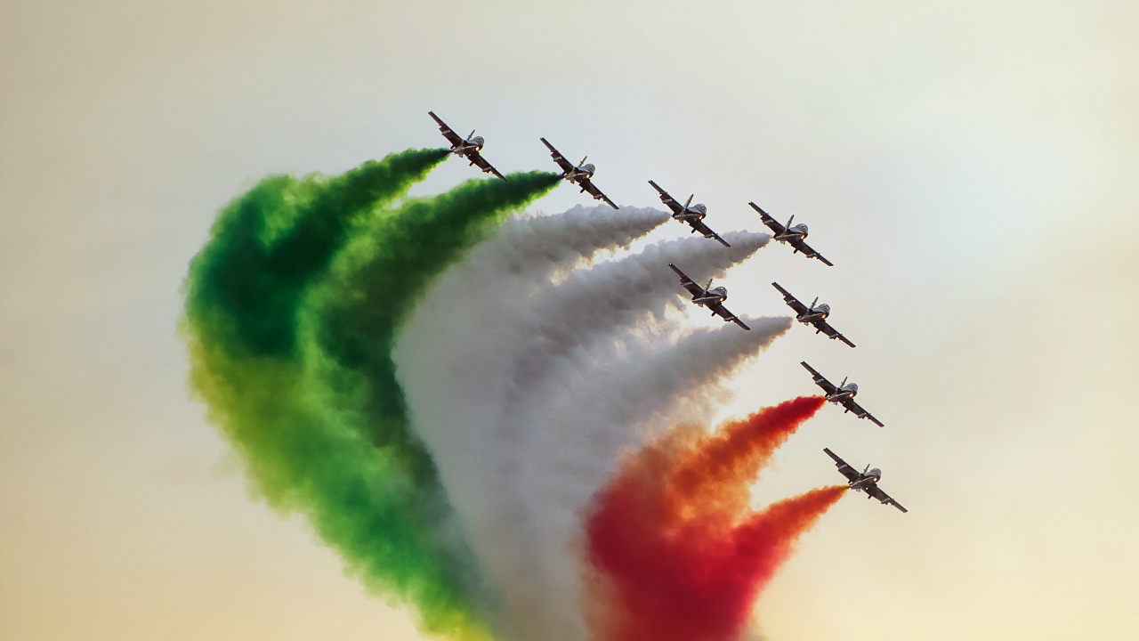 Five Black Birds Flying Over Green White and Red Smoke. Wallpaper in 1280x720 Resolution