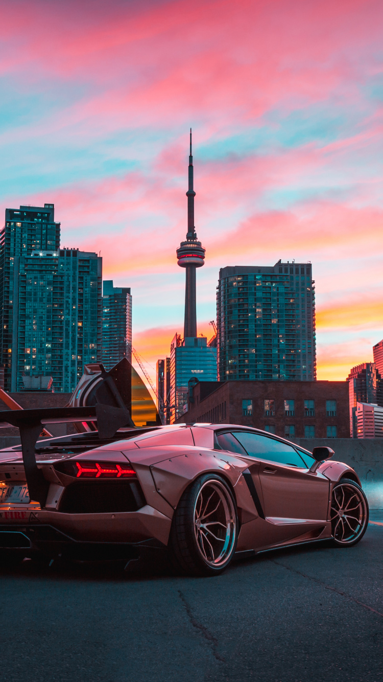 Schwarzer Porsche 911 Tagsüber Auf Parkplatz Geparkt. Wallpaper in 750x1334 Resolution