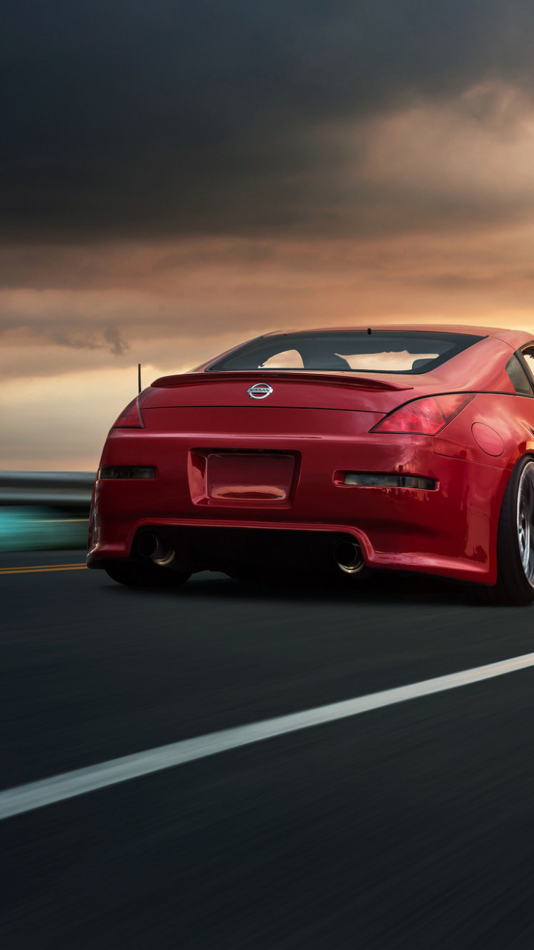 Red Porsche 911 on Road During Daytime. Wallpaper in 750x1334 Resolution
