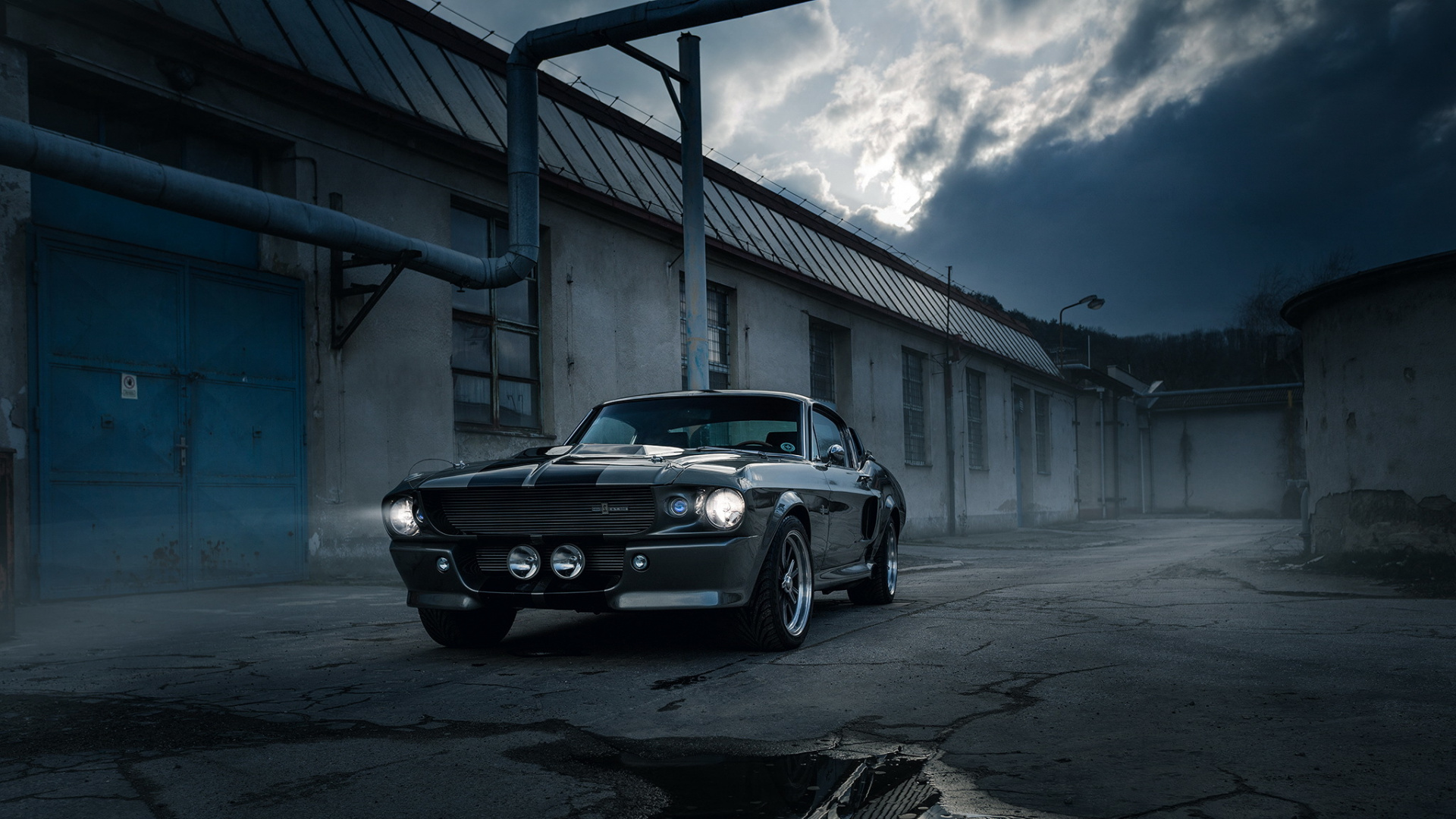 Black Sedan Parked on Gray Concrete Road During Daytime. Wallpaper in 1920x1080 Resolution