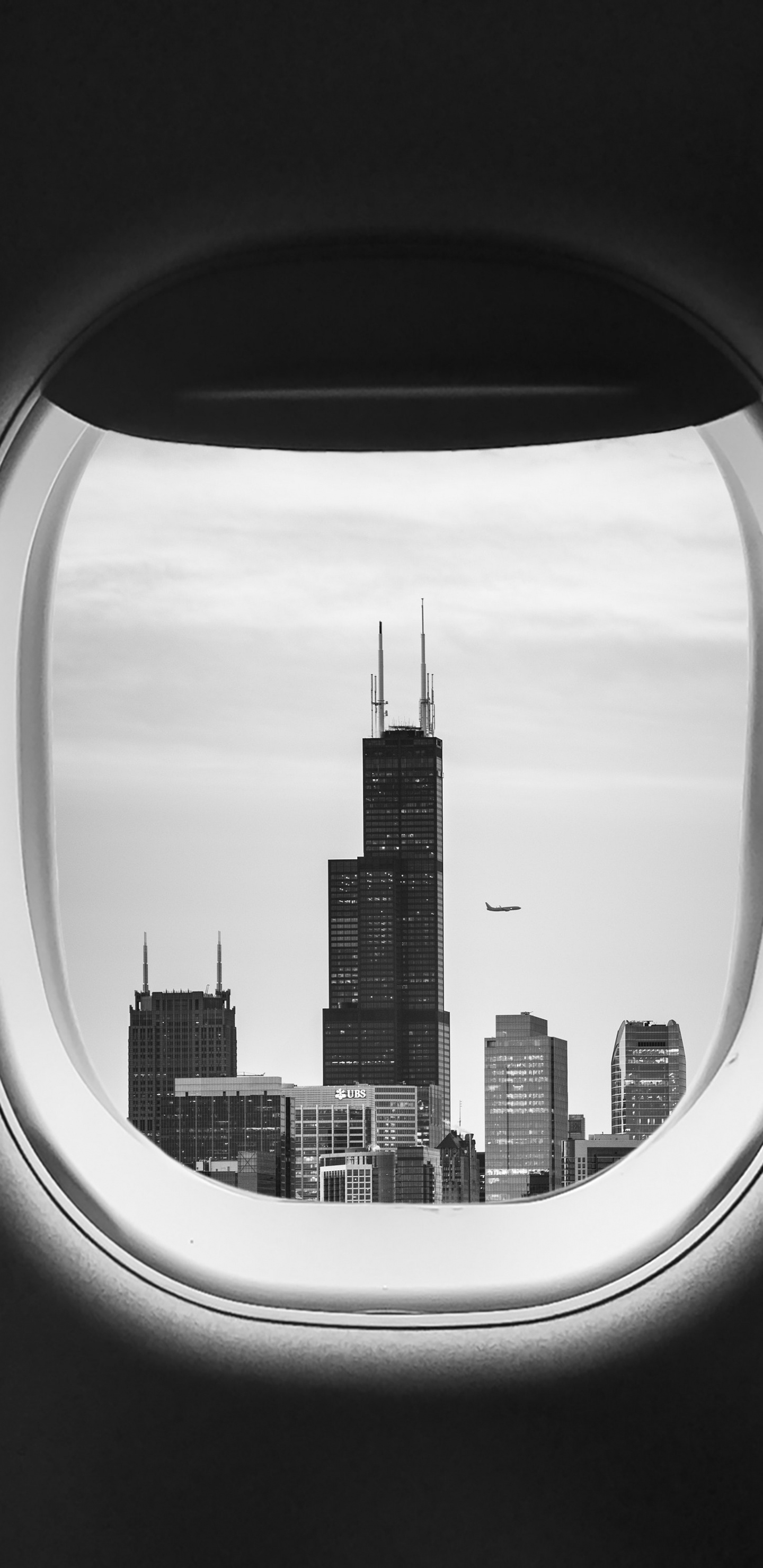 Vista de la Ventana Del Avión de Los Edificios de la Ciudad Durante el Día.. Wallpaper in 1440x2960 Resolution