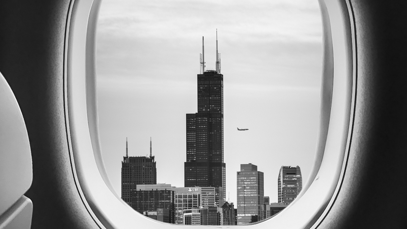 Flugzeugfensteransicht Von Stadtgebäuden Während Des Tages. Wallpaper in 1366x768 Resolution