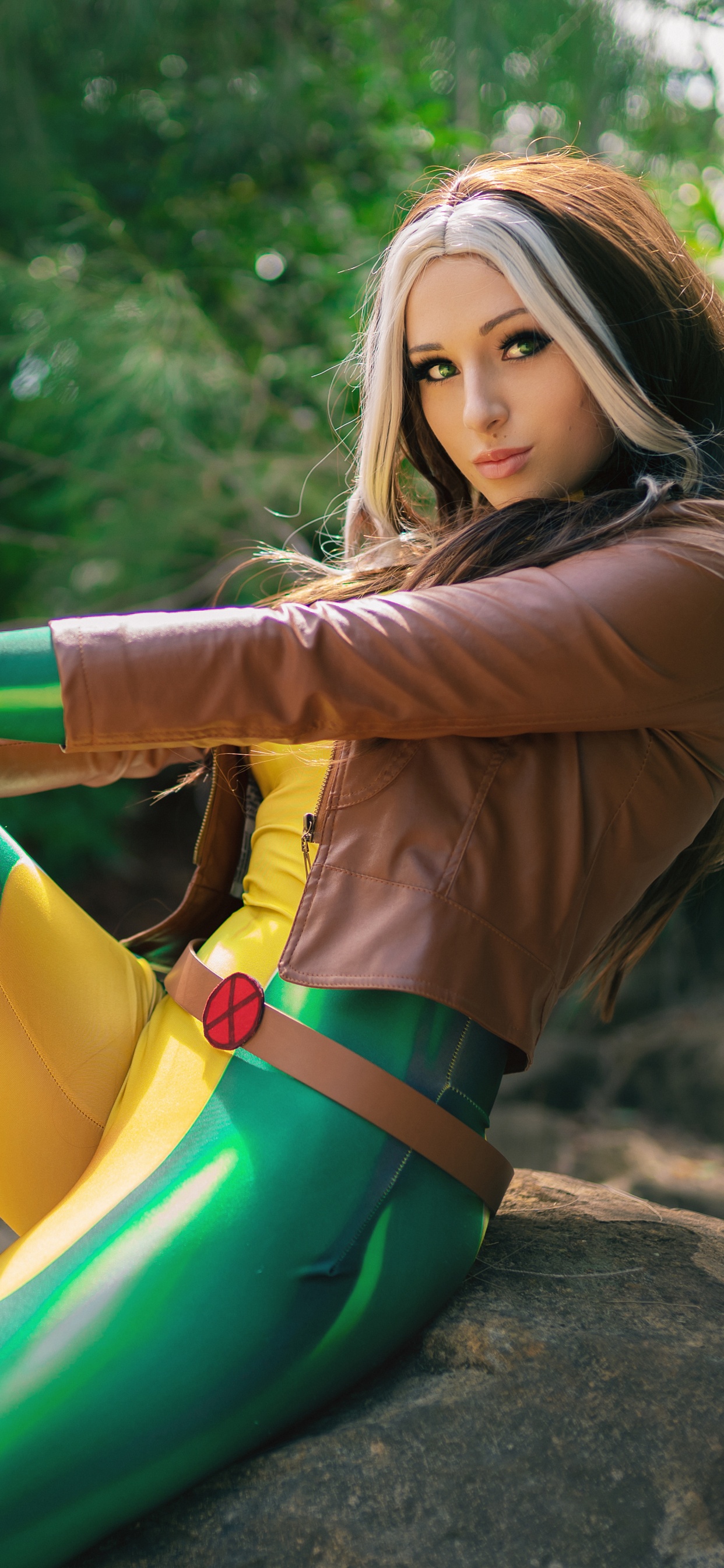 Woman in Yellow Long Sleeve Shirt and Green Pants Lying on Rock. Wallpaper in 1242x2688 Resolution