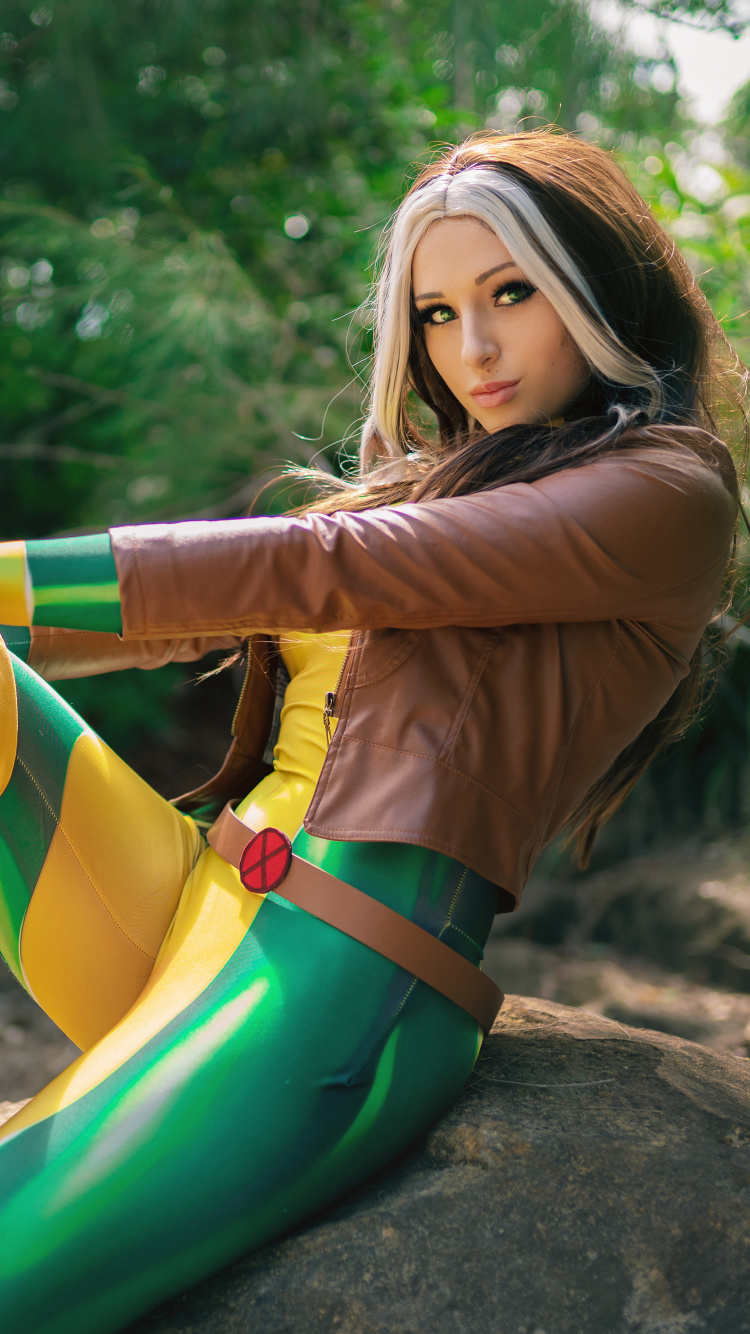 Woman in Yellow Long Sleeve Shirt and Green Pants Lying on Rock. Wallpaper in 750x1334 Resolution