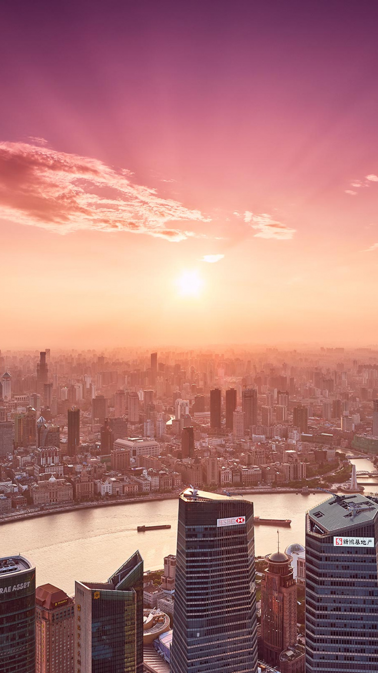 City Skyline During Sunset With City Buildings. Wallpaper in 750x1334 Resolution