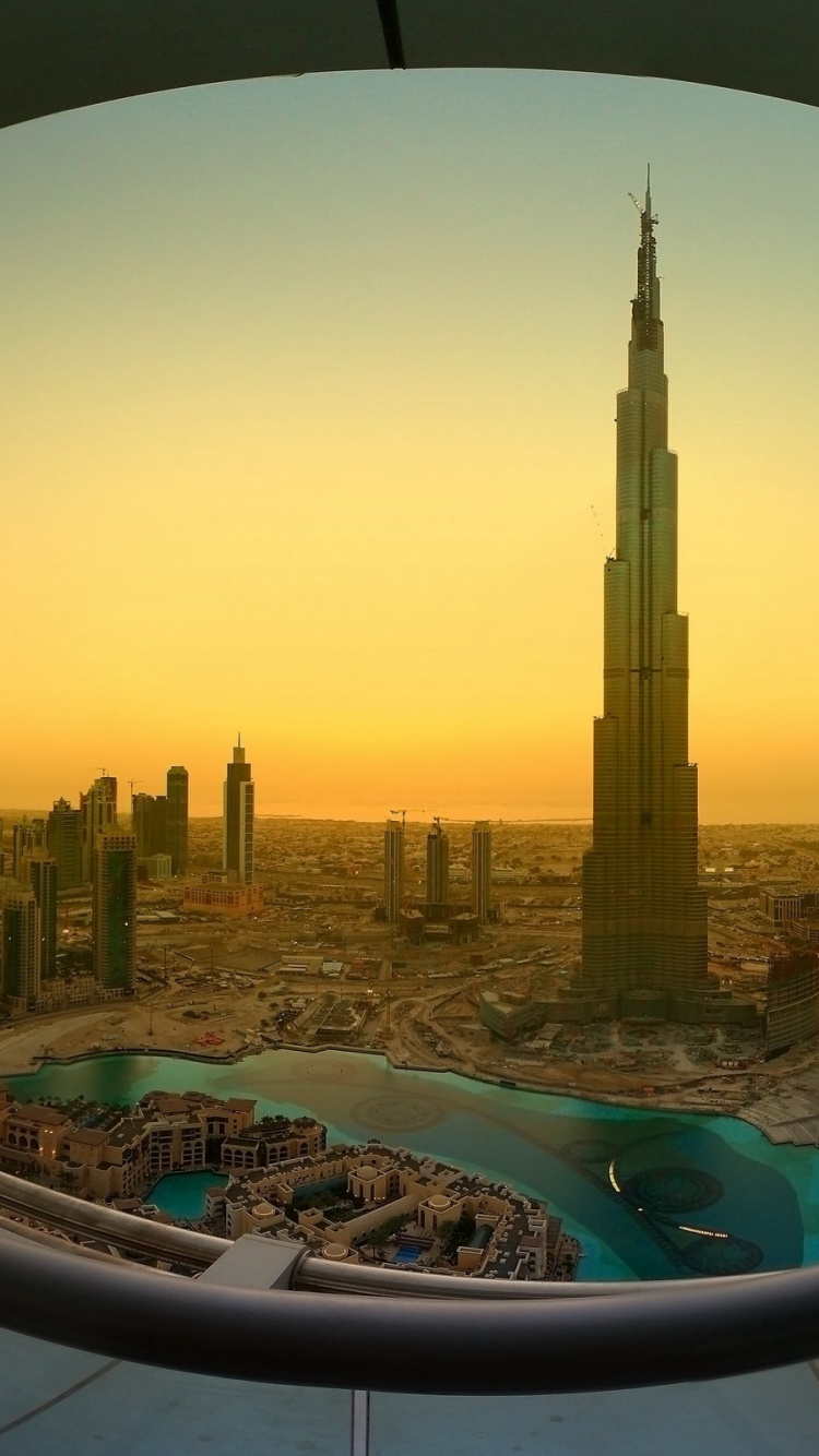 High Rise Buildings Near Body of Water During Daytime. Wallpaper in 750x1334 Resolution