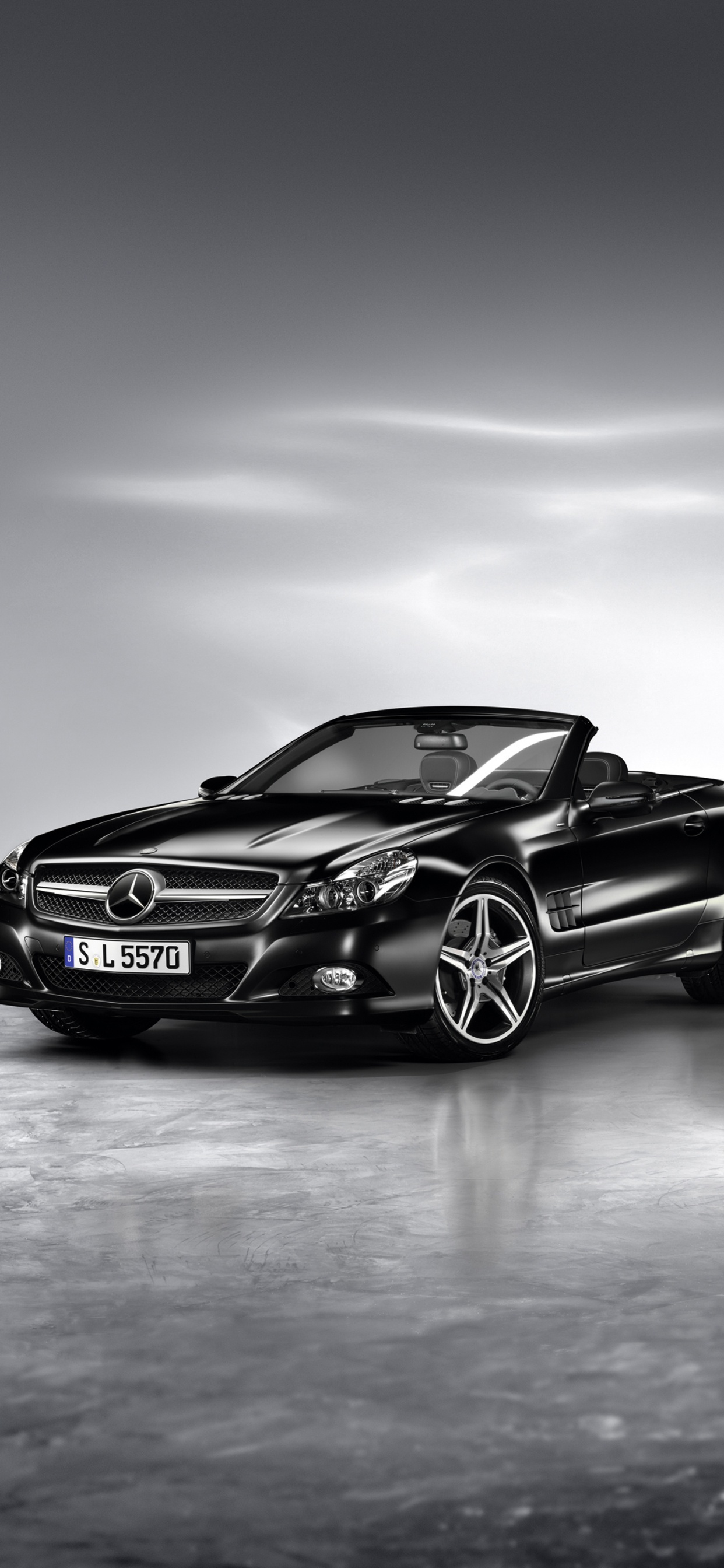 Black Porsche 911 on Gray Pavement. Wallpaper in 1242x2688 Resolution