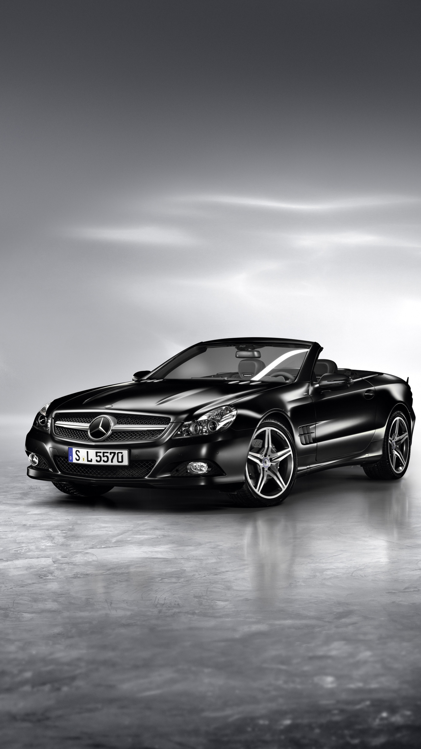 Schwarzer Porsche 911 Auf Grauem Bürgersteig. Wallpaper in 1440x2560 Resolution