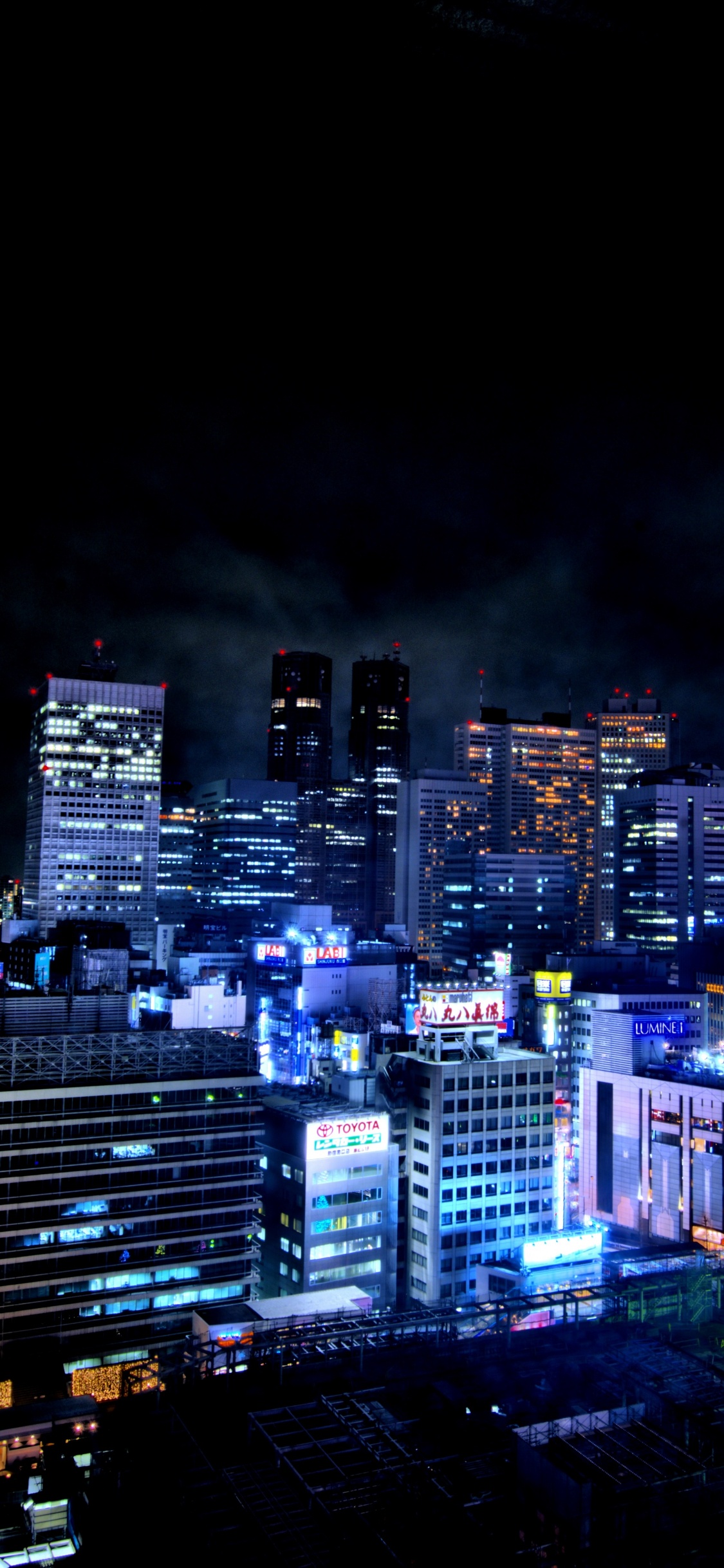 Horizon de la Ville Pendant la Nuit. Wallpaper in 1125x2436 Resolution