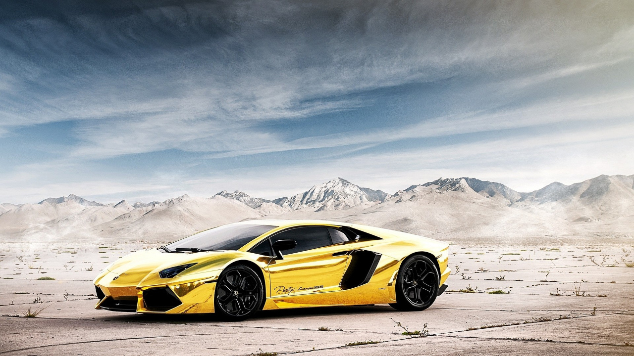 Yellow Lamborghini Aventador on Snow Covered Field During Daytime. Wallpaper in 1280x720 Resolution