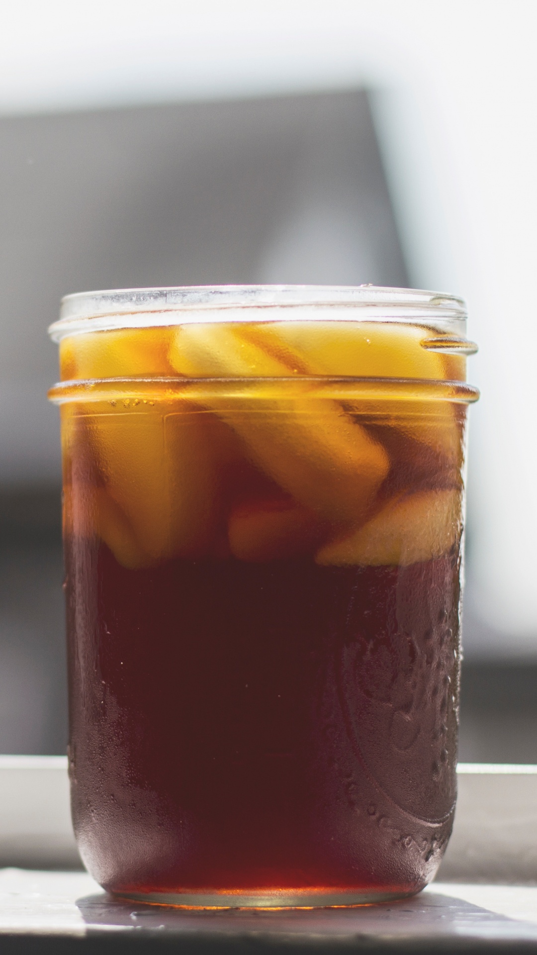 Clear Glass Jar With Brown Liquid Inside. Wallpaper in 1080x1920 Resolution