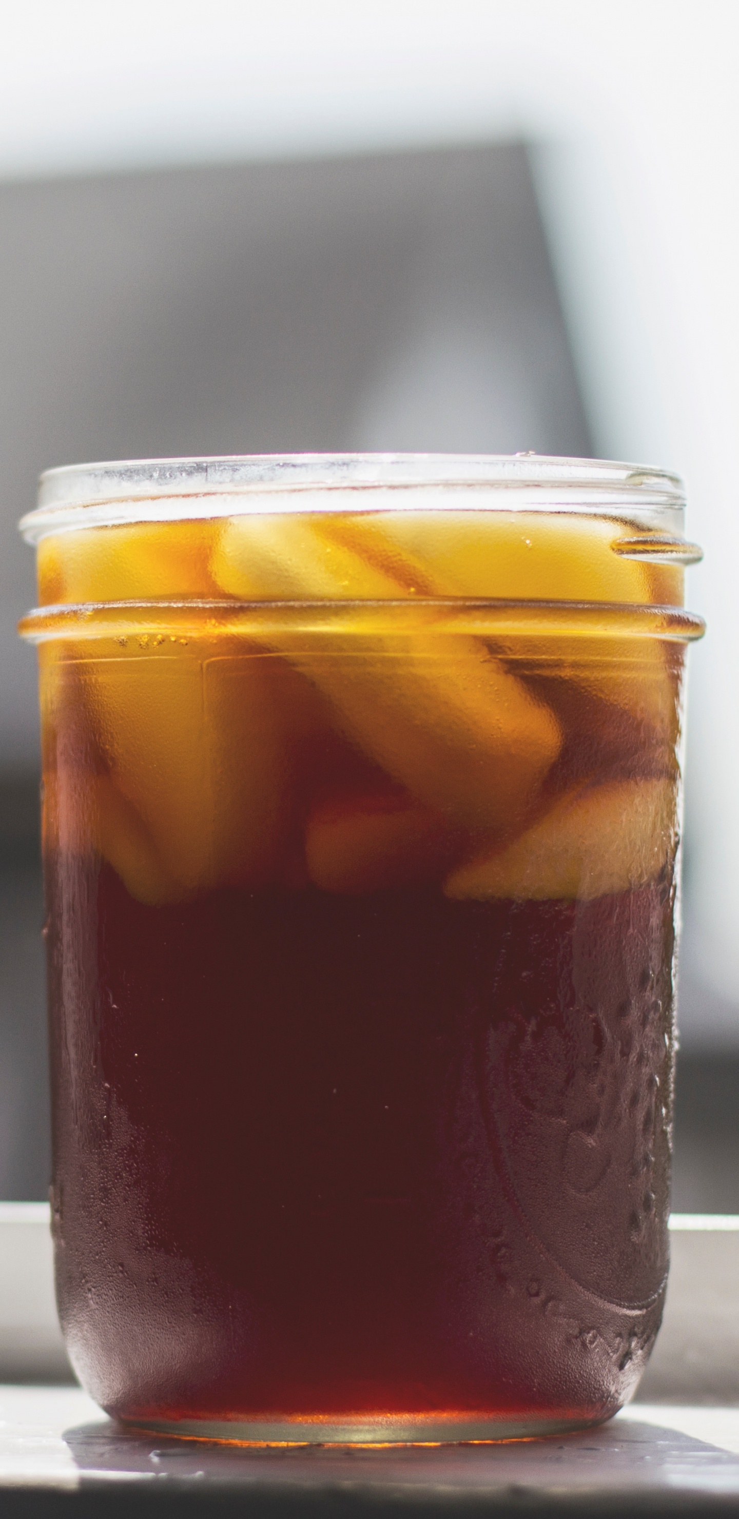 Clear Glass Jar With Brown Liquid Inside. Wallpaper in 1440x2960 Resolution