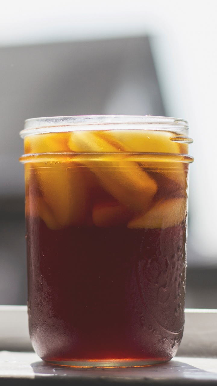 Clear Glass Jar With Brown Liquid Inside. Wallpaper in 720x1280 Resolution