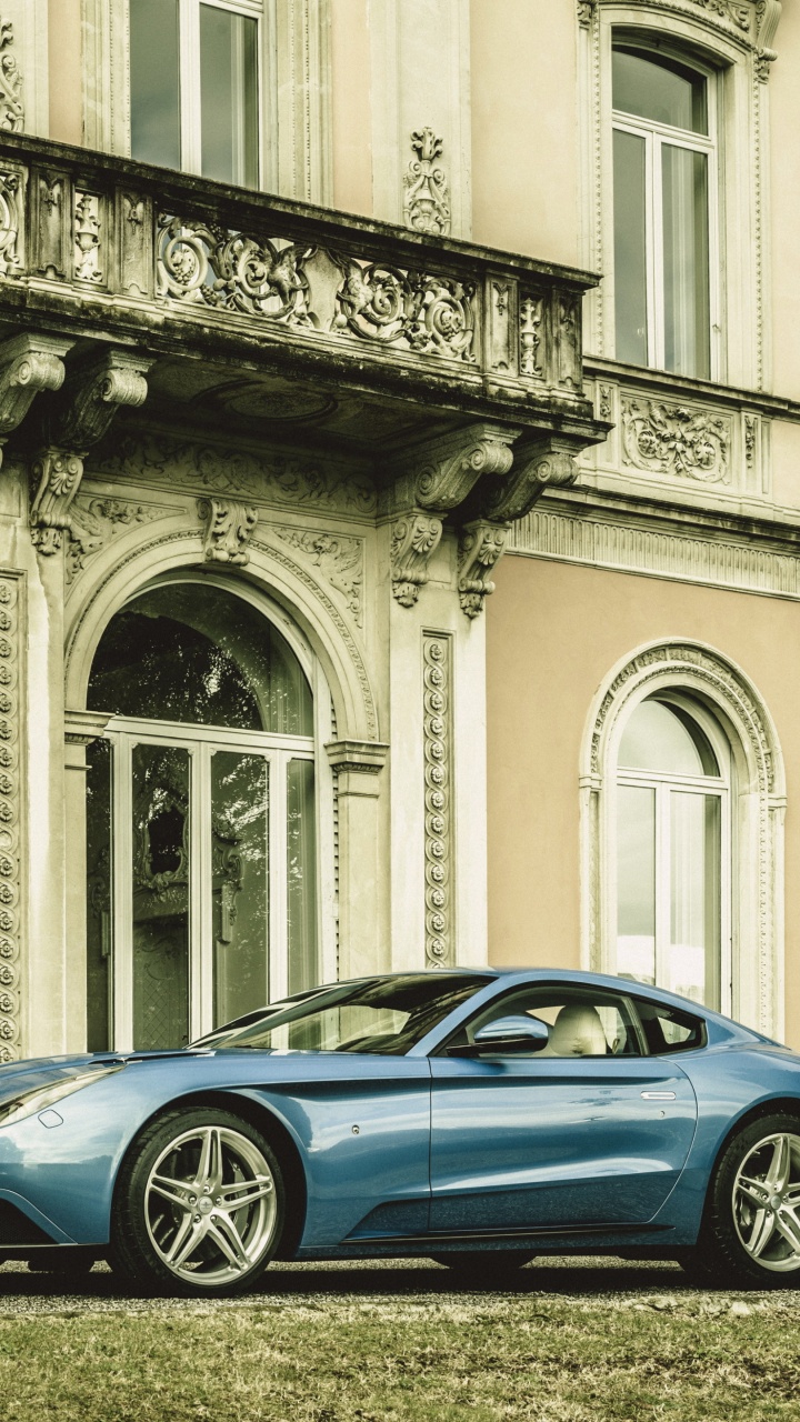 Blue Porsche 911 Parked Beside White Concrete Building During Daytime. Wallpaper in 720x1280 Resolution