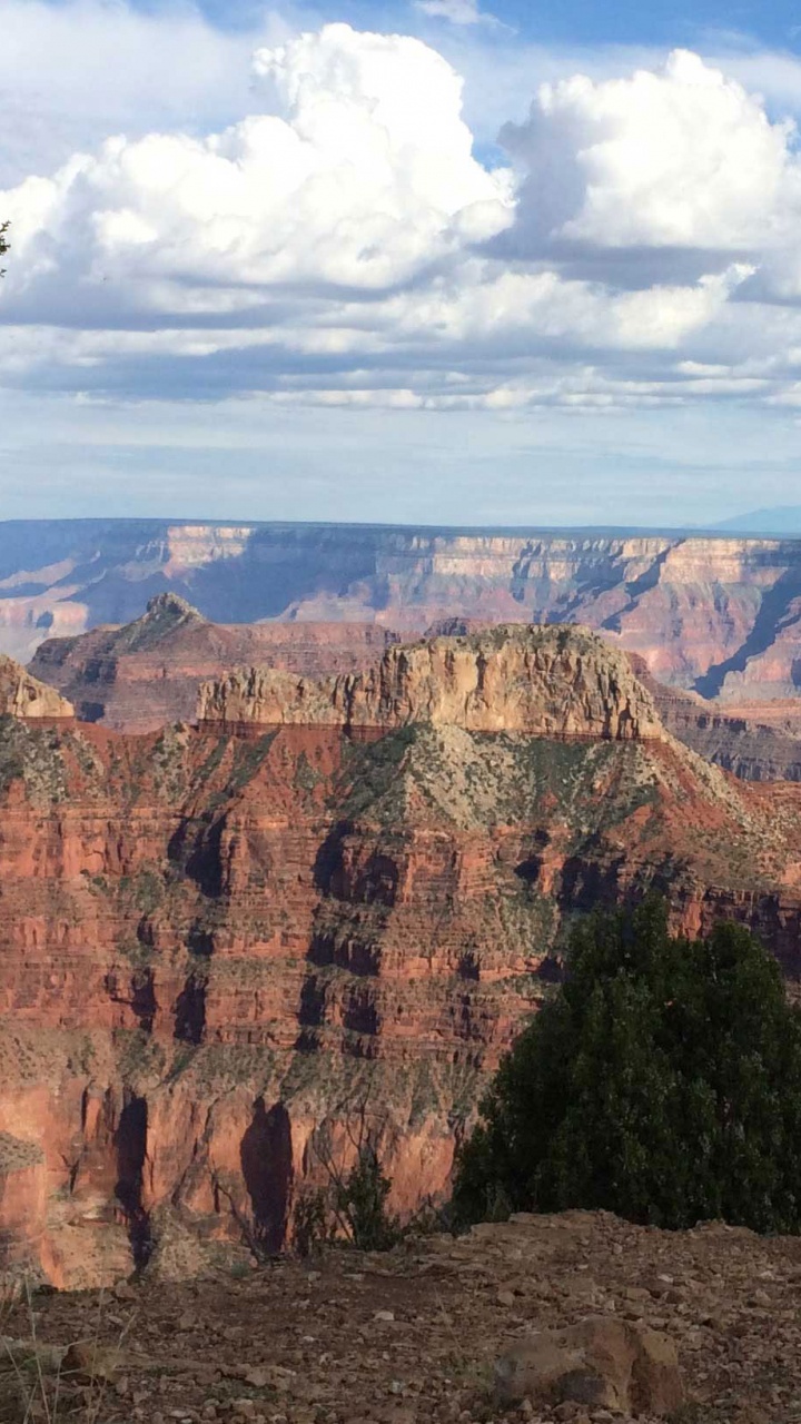 Brown Rocky Mountain Under White Clouds During Daytime. Wallpaper in 720x1280 Resolution