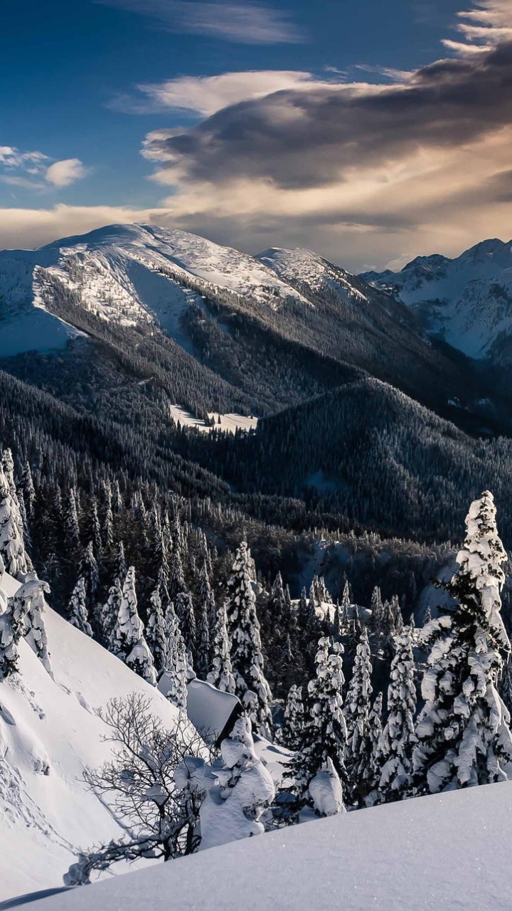 Snow Covered Mountain Under Cloudy Sky During Daytime. Wallpaper in 720x1280 Resolution