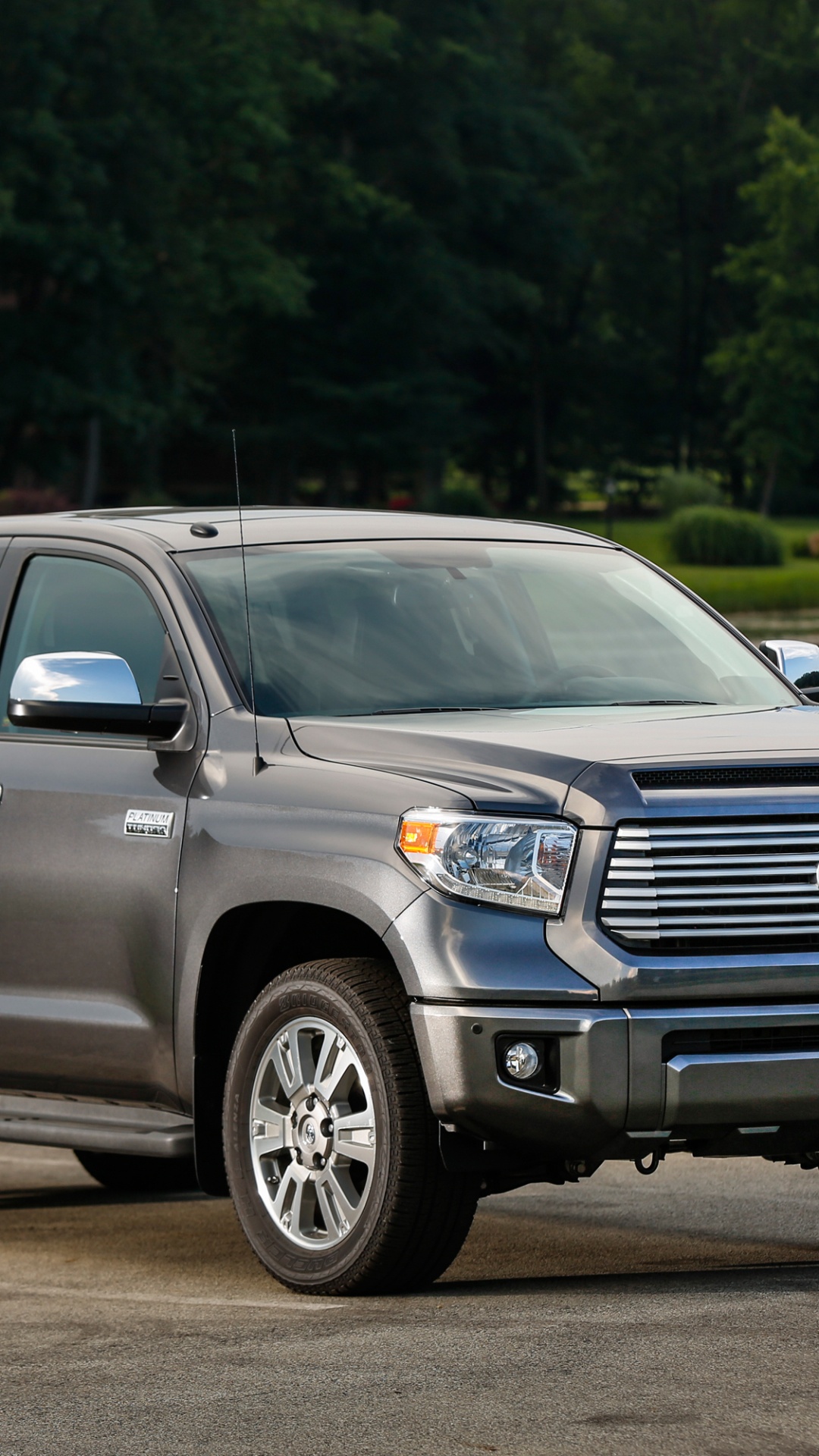 Black Ford Suv on Road During Daytime. Wallpaper in 1080x1920 Resolution