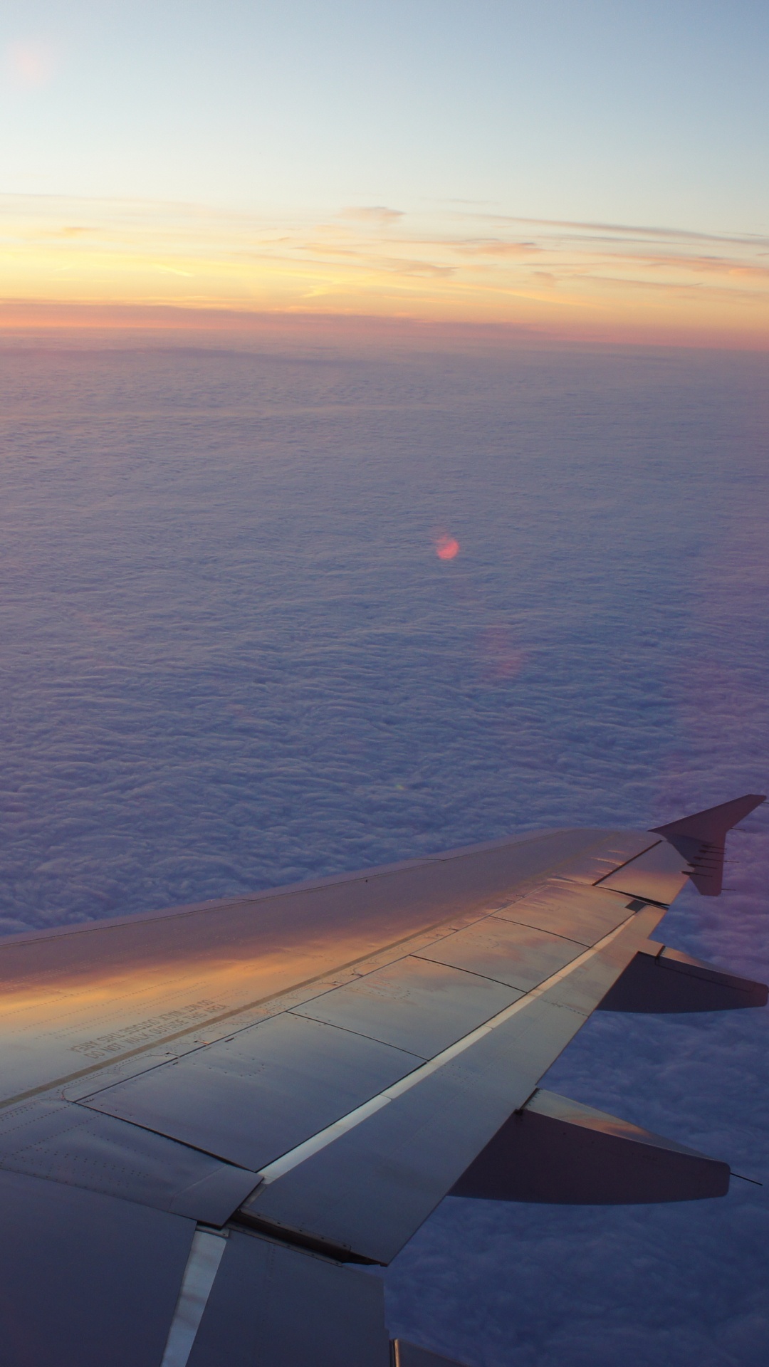 Airplane Wing Over The Sea During Sunset. Wallpaper in 1080x1920 Resolution