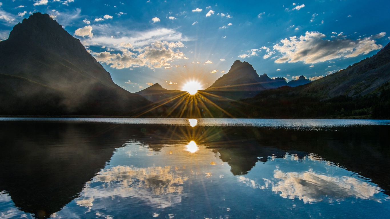 Body of Water Near Mountain Under Blue Sky During Daytime. Wallpaper in 1366x768 Resolution