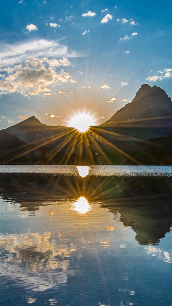 Body of Water Near Mountain Under Blue Sky During Daytime. Wallpaper in 720x1280 Resolution