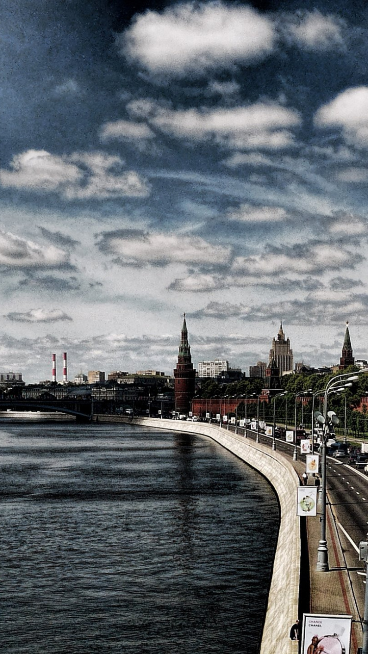 People Walking on Bridge Over River During Daytime. Wallpaper in 750x1334 Resolution
